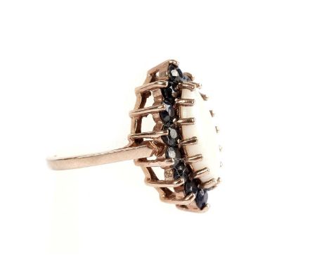 An opal and sapphire cluster dress ring, in 9ct yellow gold, size K, 4.4g gross.