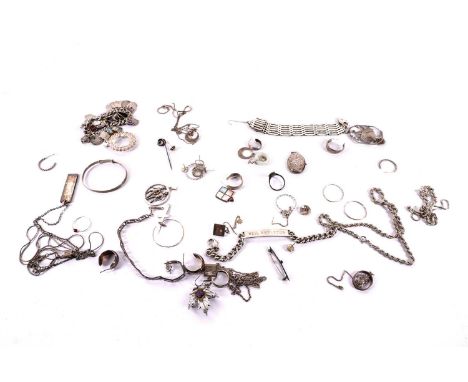 A collection of silver jewellery, including: a silver charm bracelet, with enamel souvenir charms relating to British tourist