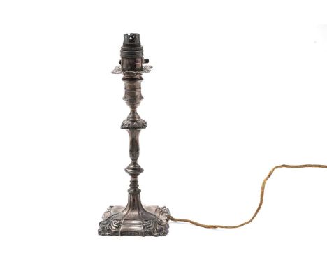 An early 20th Century silver candlestick lamp, by Hawksworth, Eyre, & Co. Ltd., 1903, with scrolling decoration, raised on a 
