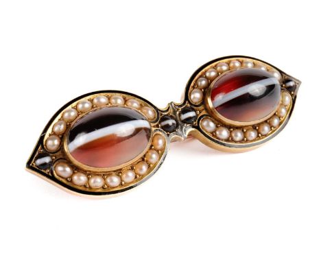 A Victorian banded agate, seed pearl, enamel and yellow gold brooch, of eye or spectacle form, converted from a pair, unmarke