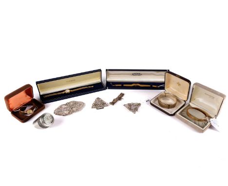 A late Victorian silver belt buckle, by G E Walton &amp; Co Ltd, Birmingham 1898; another silver belt buckle; a silver bangle