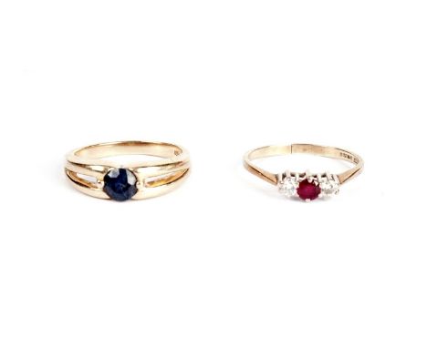 A sapphire single stone ring, in yellow gold, stamped '14K', size N; and a ruby and diamond ring, in 9ct yellow gold (shank s