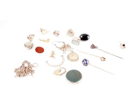 A collection of charms, including: a 9ct gold carnelian crown charm; a 9ct gold fish charm; a 9ct gold Big Ben charm; a 9ct g