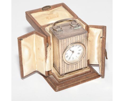Small Edwardian silver cased carriage clock with bright cut striped design to the case, white enamel dial, London 1907 makers