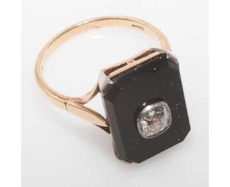 Art Deco onyx and diamond panel ring, set with an oval diamond in excess of half a carat, on yellow gold shank stamped 18ct. 