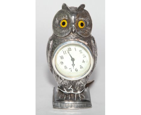 Good quality silver plated novelty mantel clock modelled as an owl with inset yellow eyes 17.5cm high 