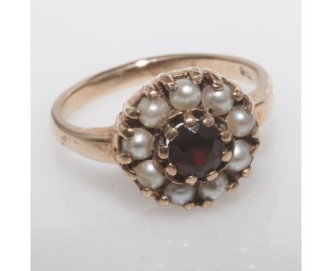 Circular pearl and garnet cluster ring, shank stamped 9ct, Ring size O