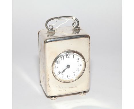 Edwardian silver cased carriage clock, plain case hallmarked for Birmingham 1906, white enamel dial on bun feet.  13cm high i