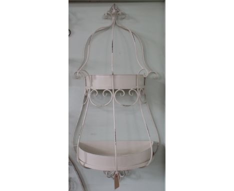 French style cream painted wrought iron double wall planter with dome top and curved panels, planted with tray liners of Busy