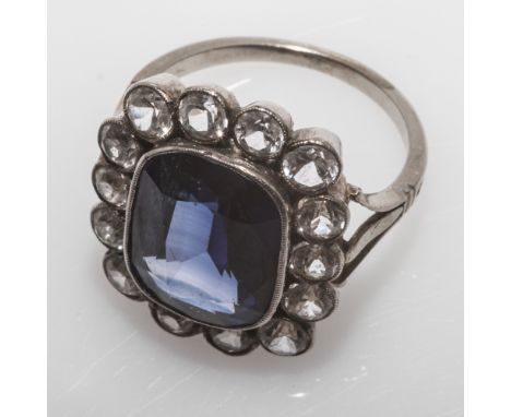 Vintage large paste cocktail ring, set with blue stone in millegrain silver setting with white stone surround, ring size L 