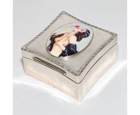 Hallmarked silver table top trinket box of square form, the lid decorated with applied enamel depicting a nude.  London hallm