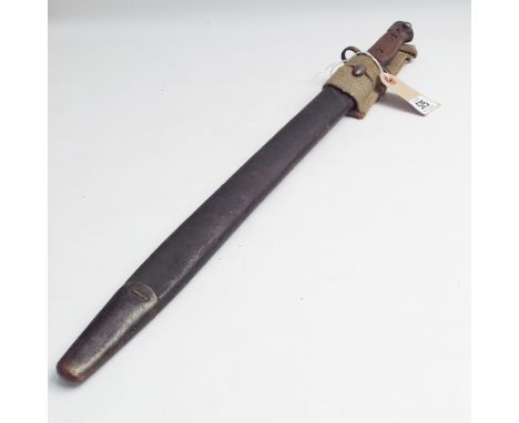 Early 20th century Enfield bayonet with leather and steel scabbard, canvas frog and wooden grip handle - 57cm long 