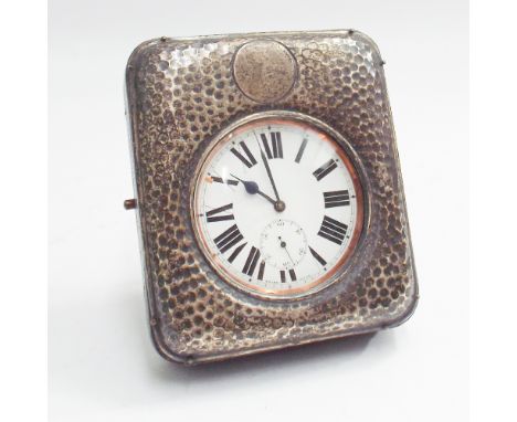 Silver plated travelling pocket watch with white enamel face in a leather and silver fronted case with beaten decoration, 11c