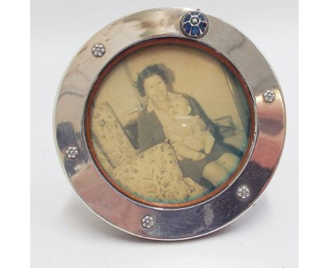 20th century Arts and Crafts silver and enamel mounted circular photograph frame by Liberty, with easel back, Birmingham 1911