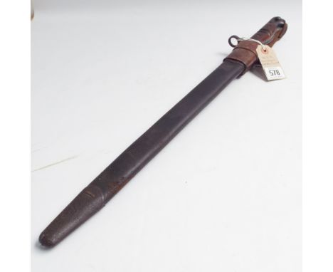 Early 20th century American Enfield bayonet with black leather and steel scabbard, brown leather frog and wooden grips to the