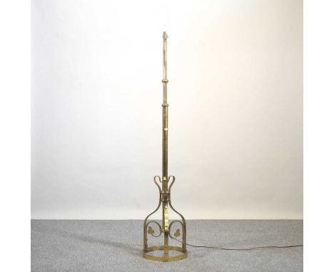 An early 20th century brass telescopic standard lamp, on a downswept base