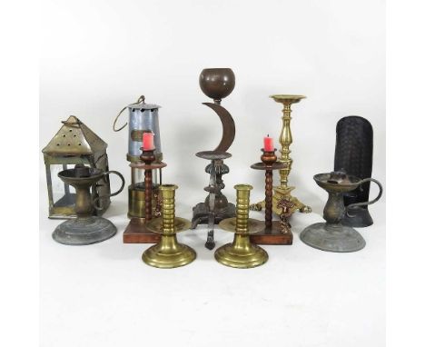 A miner's lamp, bearing a label for Naylor Wigan, 26cm high, together with a brass lantern and various candlesticks