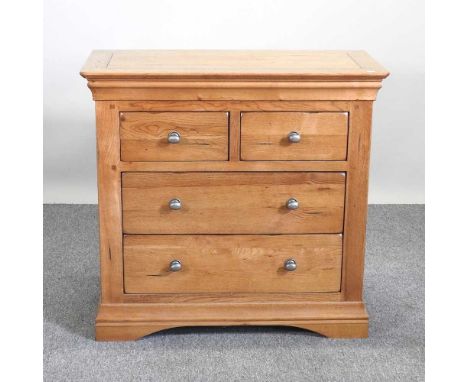 A modern light oak chest of two short over two long drawers90w x 45d x 85h cm