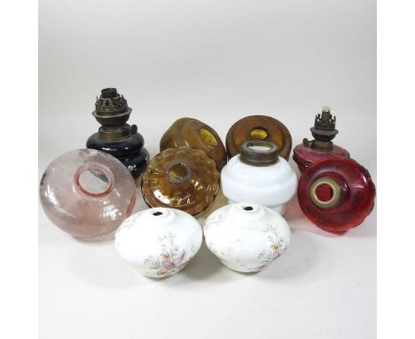 A collection of ten various coloured glass oil lamp fonts (10)
