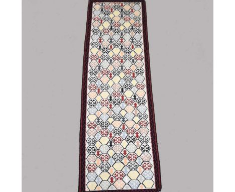 A Persian runner, with all over coloured diamonds, 250 x 80cm