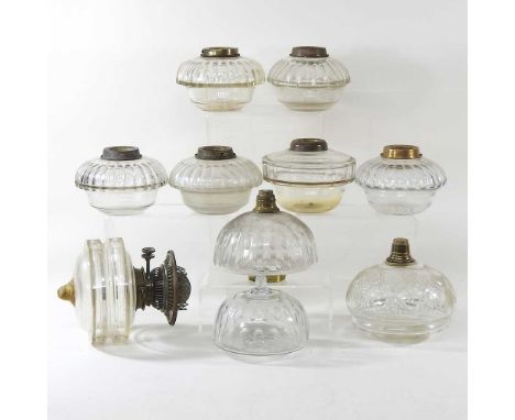 A collection of ten clear glass oil lamp fonts (10)