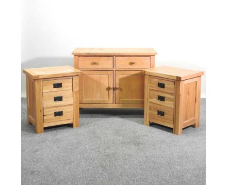 A light oak cabinet, together with a pair of light oak bedside chests (2)97w x 46d x 78h cm