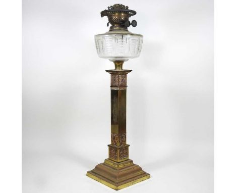 A large and ornate 19th century brass oil lamp, with filigree decoration and a cut glass font, 59cm highOverall complete, but