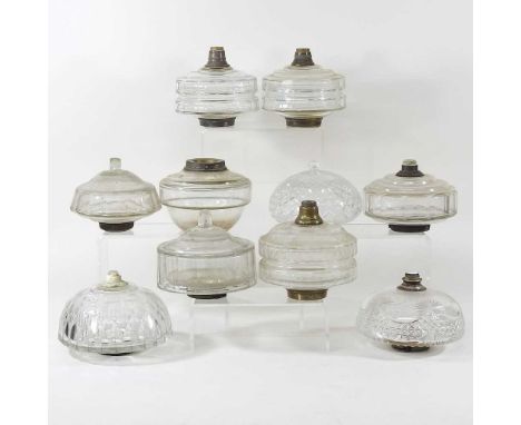 A collection of ten clear glass oil lamp fonts (10)