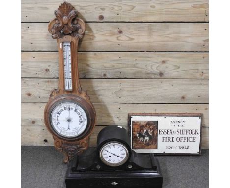 A Victorian black slate mantel clock, 30cm high, together with an early 20th century aneroid barometer and a Fire Office sign