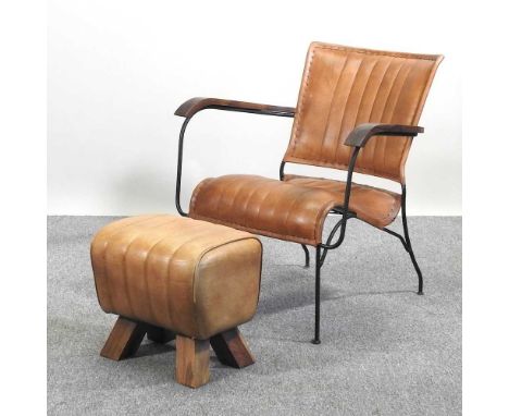 A brown leather designer armchair, with a metal frame, together with a brown leather gym horse style footstool (2)Chair: 66w 