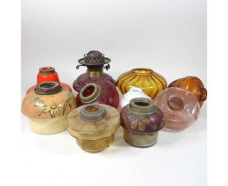 A collection of ten various coloured glass oil lamp fonts (10)