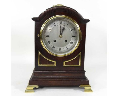 An early 20th century mahogany and brass cased bracket clock, with a silver dial and twin train movement, 35cm high