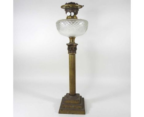 An early 20th century brass oil lamp, in the form of a Corinthian column, with a cut glass reservoir, 60cm highOverall comple