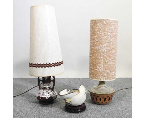 A 1970's Herda table lamp, together with another, 75cm high and a ceramic sculpture on stand (3)