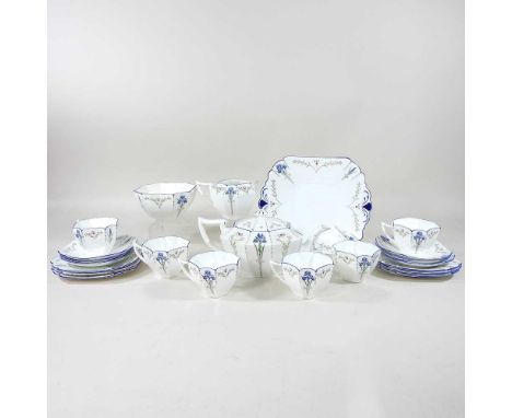 A Shelley Queen Anne tea service, circa 1935, decorated in the Blue Iris pattern, with six place settings, printed marks, Rd7