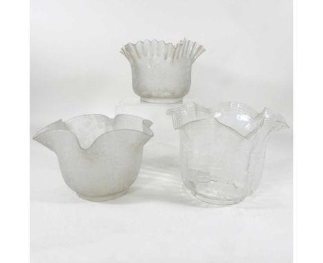Three various clear glass oil lamp shades, with etched decoration, highest 17cm (3)