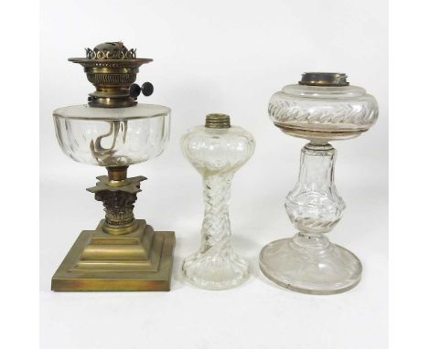 A 19th century brass oil lamp base, together with two glass lamps (3)