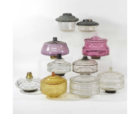 A collection of ten various glass oil lamp fonts (10)