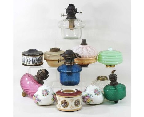 A mixed collection of thirteen various coloured glass oil lamp fonts (13)
