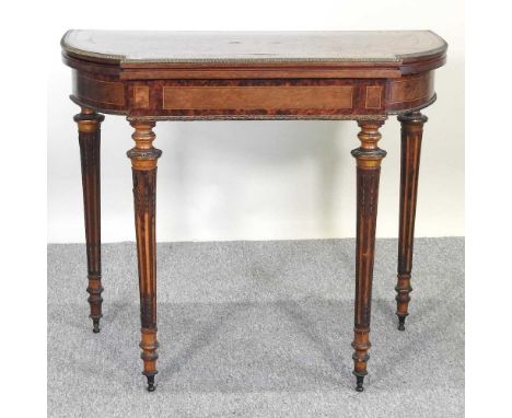 A 19th century amboyna and inlaid folding card table, with brass mounts, on turned and fluted legsSolid and usable, but scruf