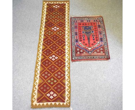 An old Baluchi rug, 136 x 92cm, together with a kilim runner, 300 x 80cm (2)
