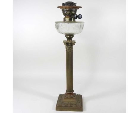 A 19th century brass oil lamp, in the form of a Corinthian column, with a cut glass reservoir, 53cm highOverall solid and com