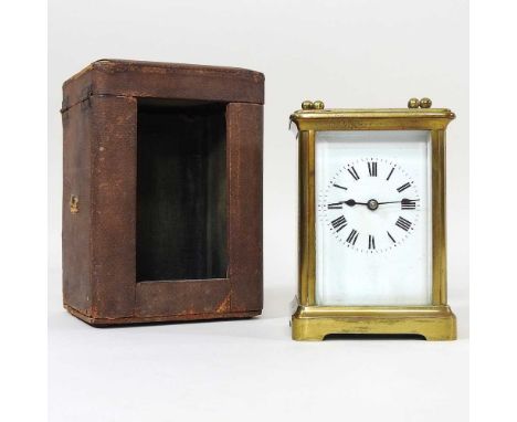 An early 20th century brass cased carriage clock, in a fitted case, with key, 15cm high