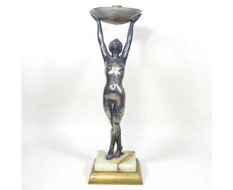 An Art Deco silvered pewter figural table lamp base, circa 1930's, in the form a young lady with her arms raised, on a green 