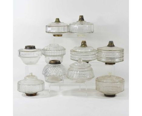 A collection of ten clear glass oil lamp fonts (10)