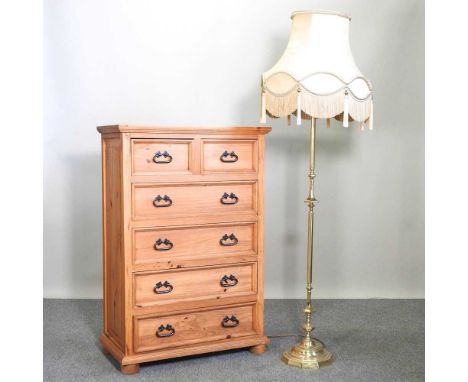 A modern pine chest of drawers, on turned feet, together with a standard lamp and shade (2)80w x 43s x 118h cm