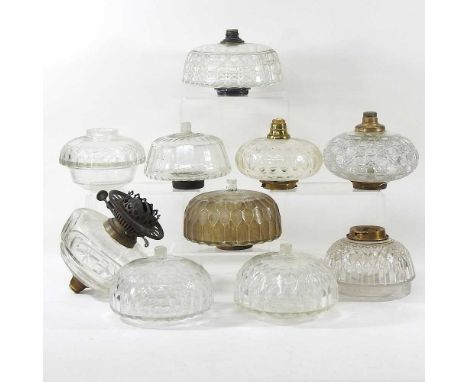 A collection of ten clear glass oil lamp fonts (10)
