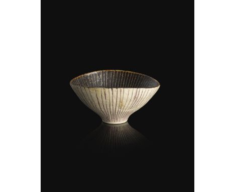 ‡Dame Lucie Rie (1902-1995) a small sgraffito and inlaid porcelain bowl, footed elliptical form, the interior glazed manganes