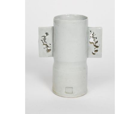 ‡Colin Pearson (1923-2007) Winged Pot a porcelain vase, waisted cylindrical form with applied wing handles, covered in a pale