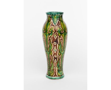 An Art Nouveau Della Robbia pottery vase by Cassandra Annie Walker,  slender shouldered form, painted with columns of stylise